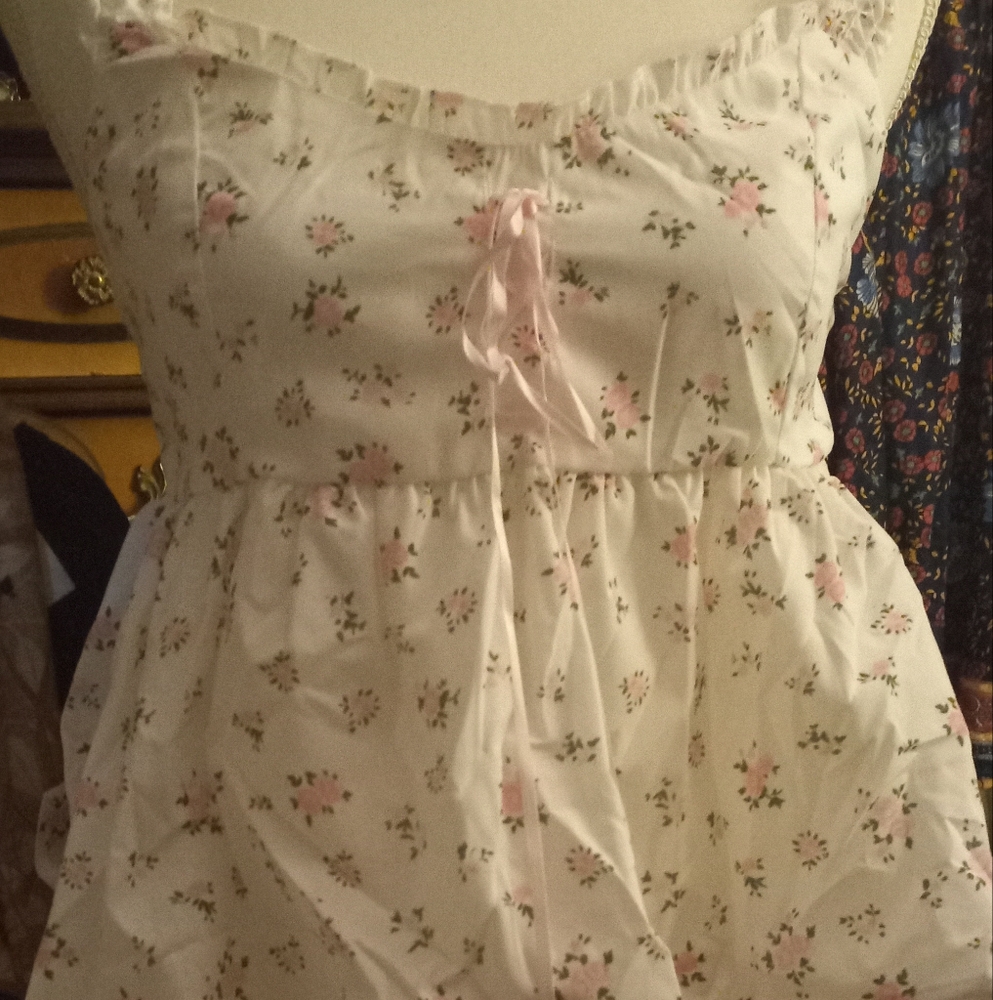 New,floral tiny pink empire waist top with ruffles& peplum bottom size medium.